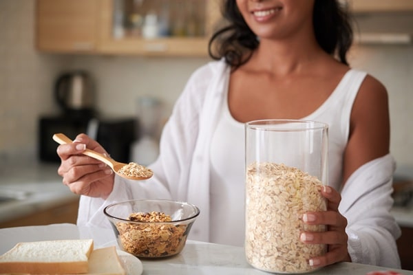 woman eating oats for breakfast